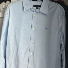 Hello, I’m Selling This Never Worn Tommy Hilfiger Shirt. It Is A Baby Blue Dress Shirt That Is Regular Fit. It Is Great For The Casual Look At Work Or Even Going Out. Tommy Dress Shirts Are Around $60. It Is Brand New. If You Are Interested Feel Free To Message Me. I’m Willing To Accept Offers As Well. Thank You! Light Blue Button-up Dress Shirt For Office, Tommy Hilfiger Classic Shirt With Button Closure, Semi-formal Light Blue Collared Dress Shirt, Tommy Hilfiger Casual Button-up Shirt, Baby Blue Dress, Blue Dress Shirt, Tommy Hilfiger Shirt, Tommy Hilfiger Cotton Button-up Shirt, Baby Blue Dresses