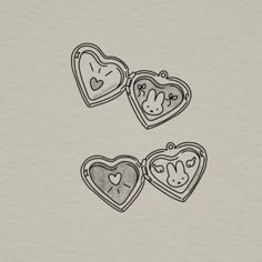 two hearts with faces drawn on them