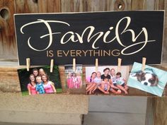 a family is everything sign with photos hanging on clothes pegs in front of a wooden fence