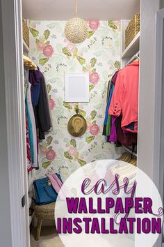 an open closet with clothes hanging on the wall