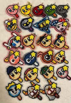 the pixel characters are all made out of different types of beads and sequins