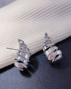 We’re OBSESSED with our spiral dupe inspired Bottega Veneta teardrop earrings. These earrings are iconic in style and provide a designer look without the luxury price tag. They make a strong statement with any outfit which makes them perfect for any occasion. These earrings have been featured on celebrities and the women on the Netflix hit show Selling Sunset. Join in on the trend and order your earrings today! Detail: Lightweight, Comfortable to wear 3.75" X 5", post back Spiral Copper alloy, g Modern Metal Teardrop Earrings For Party, Trendy Spiral Earrings For Party, Teardrop Wrap Earrings For Party, Selling Sunset, Glam Earrings, Everyday Earrings, Price Tag, Tassel Earrings, Teardrop Earrings