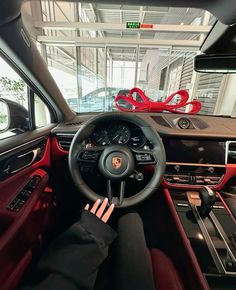 the interior of a car with steering wheel, dashboard and display area in the background