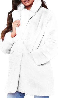 Stay chic and warm this winter in our Winter Chic Long Sleeve Faux Fur Coat! Crafted with 100% faux fur that boasts a luxurious texture, this lightweight coat is perfect for cold winter days. Enjoy the practicality of zippered pockets and an adjustable hood. Get it now and stay stylish and cozy! Faux Fur,Fleece Button closure Machine Wash Brand Size Dress Bust Waist Hip XS 0-2 31-32.5'' 23-24'' 31-34" S 4--6 33-35'' 25-26'' 35-37" M 8--10 35-36'' 27-28'' 38-39" L 12--14 38-40'' 29-31'' 40-42" XL Long Sleeve Fur Coat With Faux Fur Lining, Long Solid Color Fur Coat With Faux Fur Trim, Hooded Faux Fur Outerwear In Solid Color, Solid Hooded Faux Fur Outerwear, Faux Fur Trim Outerwear, Solid Color Outerwear With Faux Fur Trim, Winter White Fluffy Long Sleeve Outerwear, Casual Long Faux Fur Coat, Winter Faux Fur Outerwear With Pockets