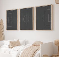 a bedroom with three chalkboards on the wall