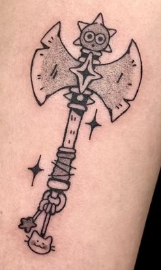 a tattoo on the leg of a person with an old style hammer