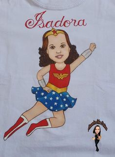 a doll is next to a t - shirt with a drawing of a girl on it