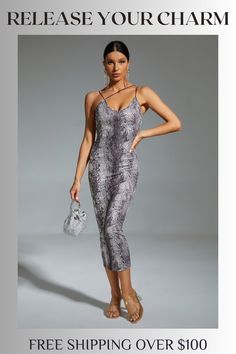 a woman in grey snake skin print jumpsuits with her hand on her hip