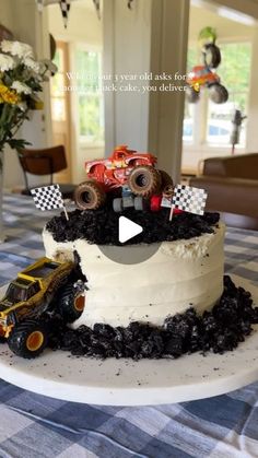 there is a cake that looks like a monster truck on top of it with dirt around the edges