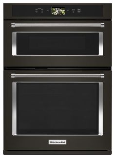 two ovens side by side with the doors open