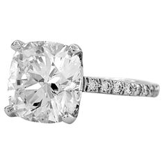 an oval cut diamond ring with pave set shoulders