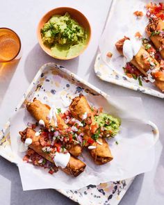 two plates filled with food next to drinks