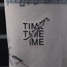 a tattoo that says time to me on it