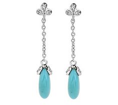 The boho-chic look of turquoise pairs effortlessly with the elegant sparkle of white topaz in these sterling silver long dangle earrings. Elegant Turquoise Long Drop Jewelry, Long Dangle Earrings, White Topaz, Silver Turquoise, Turquoise Sterling Silver, Topaz, Boho Chic, Dangle Earrings, Jewelry Earrings