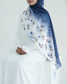 Crafted from premium quality chiffon, this hijab exudes both luxury and modesty. The delicate fabric has a silky smooth texture and is lightweight, effortlessly falling into an elegant floral pattern. Ombre Hijab, Blue Semi-stitched Chiffon Dupatta, Luxury Silk Chiffon Scarves, Semi-stitched Blue Floral Print Dupatta, Luxury Silk Chiffon Scarves, Elegant Style, Luxury Blue Scarf With Floral Print, Modest Activewear, Full Coverage Swimsuit, Abaya Dress