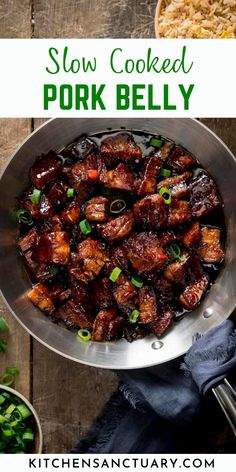 slow cooked pork belly in a pan with green onions and parsley on the side