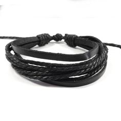 This bracelets consist of several layers of rope and leather and will match any outfit. Stack this bracelet with other bracelets for a stylish look. Adjustable, will fit arms of many different sizes. Simply pull the cords to make the bracelet smaller, and the sides to expand the bracelet. Bracelet Circumference: minimum 6.5 inches, expanded 13 inches. Material: Leather, Rope Cord. Adjustable Braided Leather Bracelet, Adjustable Leather Braided Bracelets, Adjustable Leather Braided Bracelet Casual, Casual Adjustable Leather Braided Bracelets, Casual Adjustable Braided Leather Bracelet, Casual Adjustable Leather Braided Bracelet, Adjustable Trendy Leather Bracelet, Trendy Adjustable Wristband Fashion Accessory, Black Bohemian Bracelet With Waxed Cord