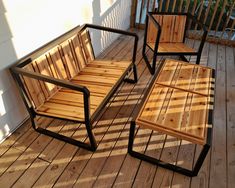 three wooden chairs sitting on top of a wooden deck