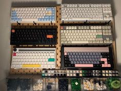 there are many different keyboards and mouses on the shelf in front of each other