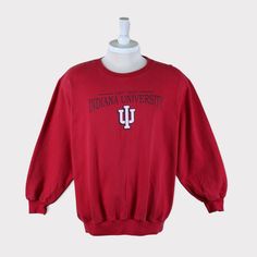 Vintage 90s Indiana Hoosiers (Indiana University Bloomington) Football/Baseball/Basketball/Hockey NCAA Sweatshirt 💯 SATISFACTION AND AUTHENTICITY ⭐ MEASUREMENTS (when laid flat) Size on Tag: XL (fit L) Length: 68cm or 27 inches Armpit to armpit: 59cm or 23.5 inches ⭐ CONDITION 9/10 (Very good) Details: No holes Material: Cotton Color: Red Brand: College Ware USA 🔷 Please give us your phone no. together with address after you purchased. 🔷Please keep in mind that our items are vintage so they m 90s Oversized Tops For College, Cotton Tops With Ribbed Cuffs For Fan Merchandise, 90s Crew Neck Tops For Game Day, 90s Style Tops With Ribbed Cuffs For College, Collegiate Cotton T-shirt With Ribbed Cuffs, 90s Style Cotton Top For Game Day, 90s Long Sleeve Top For Game Day, 90s Style Long Sleeve Tops For Game Day, 90s Long Sleeve T-shirt For College