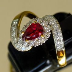 STUNNING YELLOW GOLD 22K NATURAL RUBY PEAR 0.78 Cts DIAMONDS HALO RING Name : Ring Yellow Gold Metal Purity : 22K Ring Size: 8.30. Main Stone Weight : 0.78 Carats. Diamonds Weight : 0.25 Cts. Diamonds Clarity : VS1 to SI1. Diamonds Color : H. Main Stone :  Ruby. Main Stone Shape : Pear Gold Weight: 4.54 Grams. This item will be sent with FedEx (estimated delivery 3 to 4 working days) Fine Jewelry Gold Ruby Ring Gia Certified, Gold Ruby Ring Pear-shaped, Pear-shaped Brilliant Cut Yellow Gold Ruby Ring, Pear-shaped Ruby Ring In Gold, Gold Pear-shaped Ruby Ring, Yellow Gold Teardrop Ruby Ring For Anniversary, Pear-shaped Ruby Diamond Ring In Gold, Pear-shaped Yellow Gold Ruby Ring, Pear-shaped Gold Ruby Ring With Diamonds