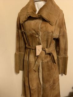 NWT Women’s Salco Genuine Shearling Coat Italy Tan Color Long With Belt Size44/8. Condition is "New with tags". Shipped with USPS Priority Mail. Luxury Long Sleeve Sheepskin Fur Coat, Luxury Beige Sheepskin Fur Coat, Luxury Mink Shearling Fur Coat, Designer Sheepskin Fur Coat With Faux Fur Lining, Designer Sheepskin Fur Coat, Designer Leather Fur Coat With Faux Fur Lining, Shearling Coat, Tan Color, Belt Size