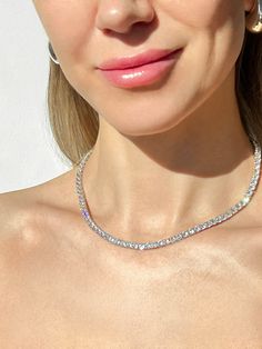 This elegant tennis necklace is crafted from 925 solid sterling silver and is studded with sparkling 4mm round-cut created diamonds for a total carat weight of 24.00-45.00TCW. The perfect accessory for any formal occasion, this necklace is both sophisticated and exclusive. This exquisite necklace has high polished rhodium finish that gives it a stunning shiny look that lasts for many years.Our created diamonds and gemstones are synthetic simulants (NOT natural/lab-grown/moissanite) that feature brighter D color , FL/VVS1 clarity and ideal cut making them visually indistinguishable from natural diamonds that cost thousands of dollars, but they don't pass the diamond test. We only use high quality solid gold/silver in our jewelry, WE DO NOT sell fake gold/silver jewelry. Every item, is shipp Concept Jewelry, Gold Silver Jewelry, Moissanite Jewelry, Tennis Necklace, Chain Anklet, Chain Gold, Pretty Gift, Huggie Hoop Earrings, Gorgeous Gift