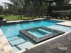 an empty swimming pool in the middle of a yard