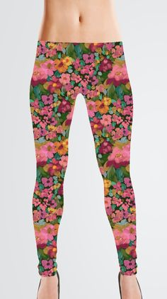 a woman's leggings with colorful flowers on it