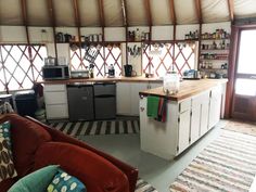 the kitchen is clean and ready to be used as a living room or dining area