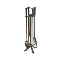 a metal rack with three candles on it