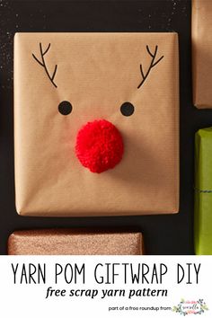 a paper bag with a reindeer's nose on it next to other wrapping materials