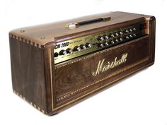 an old fashioned wooden amp with the word marshall on it's front and sides