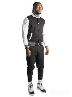 black and white mens varsity sweatsuit set mens hoodie mens joggers mens tracksuit  Unisex varsity jacket jogger set is a great gift for her or gift for him sweatsuit.  Comes with a varsity jacket style button up and joggers  This set is made from thick warm strong durable but soft cotton  Fits true to usa sizes Shipping  Free 1-3 day shipping item usually ships out in 1 business day  I also ship out items on Saturday's when possible 1 day shipping is available for a fee Winter Streetwear Sweats With Elastic Cuffs, Winter Sweats With Elastic Cuffs For Streetwear, Casual Streetwear Sweat Resistant Activewear, Casual Sweat Resistant Activewear For Streetwear, Winter Streetwear Joggers With Elastic Cuffs, Urban Style Relaxed Fit Sweats For Sports, Ribbed Waistband Sweats For Winter Streetwear, Sporty Fleece Track Jacket With Relaxed Fit, Sporty Fleece Sweatshirt With Elastic Cuffs