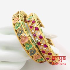 2.6 size Mint Green Meenakari Kundan Bangles with CZ and Ruby Stones Features: Made in Brass with 22 Karat Gold polish Pair of 2 Bangles Thickness: Approx. 0.5 Inches Available in size 2.6 Kundan Kada, Kada Bangles, Traditional Wedding Jewellery, Ruby Bangles, Kundan Bangles, Bangles Indian, Bridal Bangles, Stone Feature, Indian Wedding Jewelry