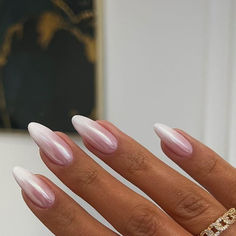 a woman's hand with pink and white acrylic nails