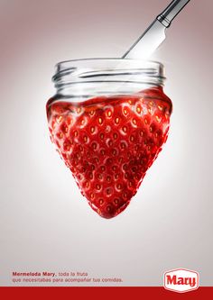 a strawberry in a jar with a knife sticking out of it's top and the caption reads, marvy