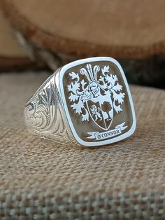 You can ask us all questions. *Logo area: Square * The width of the logo area is 19*19mm. *There are special embroideries on the side arms of the ring. *I can make our rings in 10K, 14K, 18K and 22K gold. *The ring is 925 Sterling Silver. *The ring has my Brand and 925K stamp on it. * Extra discount is provided for 3 or more product orders. *Before the rings are prepared, a design will be sent to you for your approval. After the product is prepared, a photo of the finished product will be sent t Anniversary Silver Engraved Ring, Silver Rings With Engraved Logo For Anniversary, Classic Engraved Ring With Logo For Gift, Classic Engraved Ring With Logo As Gift, Anniversary Rings With Engraved Logo, Custom Hallmarked Signet Ring For Wedding, Custom Wedding Signet Ring Hallmarked, Silver Jewelry With Engraved Logo For Gift, Classic Rings With Engraved Logo For Gift