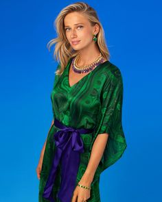 Crafted from beautifully draping silk, our Regina Belted Silk Kaftan feels incredibly sensuous and soft. A subtle sheen highlights the flutter of every movement. At once bold and mysterious, our Regina Belted Kaftan in Precious Malachite conveys a jolt of the hypnotic deeply rich green stone that has captivated so many civilizations, from the Egyptians to the Aztecs and the Europe, across a vast breadth of time. The Egyptians bestowed malachite with powers to ward off evil, while Faberge showcas Luxury Green Silk Evening Dress, Elegant Green Dress With Kimono Sleeves, Green Silk Kaftan With Kimono Sleeves, Green Silk Dress With Kimono Sleeves, Elegant Silk Dress With Kimono Sleeves, Elegant Green Kaftan For Evening, Elegant Green Spring Kaftan, Elegant Green Formal Kaftan, Silk V-neck Evening Kaftan