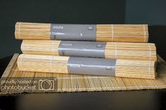 three stacks of bamboo sitting on top of a table