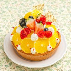 there is a cake with fruit on top