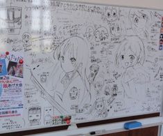 a white board with anime characters drawn on it