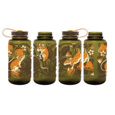 three green jars with orange designs on them