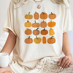 Pumpkin Shirt, Halloween Shirt, Fall Apparel, October Festive Shirt Discover Our Latest Range Of Versatile And Stylish T-Shirts (Gildan 5000), Where Style Harmonizes With Unparalleled Comfort! Featuring Sizes From S To 3xl And A Vibrant Spectrum Of Colors Such As Black, White, Sand, Green, Sport Grey, Red, Navy, And More, There's A Choice To Cater To Every Taste. Crafted With Precision Using Top-Notch Materials, Our T-Shirts Offer A Luxurious Sensation And An Impeccable Fit That Endures Througho White Short Sleeve Shirt For Fall, Orange Graphic Tee For Fall, Fall T Shirts, Fall Apparel, Pumpkin Gift, Halloween Top, Pumpkin Colors, Festival Shirts, Pumpkin Shirt