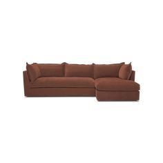 a brown sectional couch with pillows on it's back and the seat folded out