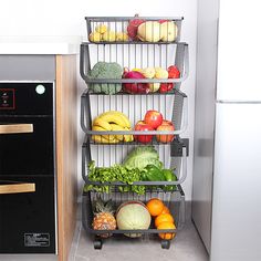 a bunch of fruits and vegetables are stacked on the rack in front of an oven