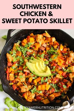 southwest chicken and sweet potato skillet with avocado on the side in a cast iron skillet