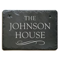 the johnson house slate sign on a white background