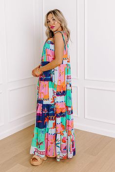 - Step into a tropical paradise with this stunning colorful maxi dress, adorned with a vibrant print that captures the essence of exotic getaways. Delicate tied spaghetti straps and a flowing silhouette create an effortlessly chic look, perfect for warm, sun-kissed days and breezy evenings. Whether you're lounging by the beach or exploring new destinations, this dress promises to be your go-to piece for embodying laid-back elegance and carefree summer vibes. - Fully lined lightweight material wi Vibrant Print Sleeveless Vacation Dress, Printed Maxi Dress For Vacation Brunch, Multicolor Sundress For Vacation Brunch, Multicolor Sundress For Brunch And Vacation, Multicolor Sundress For Brunch On Vacation, Summer Sundress With Vibrant Print For Vacation, Tropical Print Maxi Sundress For Beach Season, Vibrant Print Sundress For Beach Vacation, Blue Sundress For Poolside