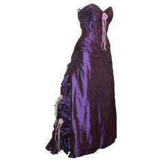 Vicky Tiel Purple Silk Taffeta Strapless Gown w/ Organza Floral Detail On Back - 42. This special gown is in excellent condition. This dress features a purple silk taffeta material, built-in corset to the hips, organza flower detail in the front and down the back, a ruffle train to the bottom, and a bustled back. The tag on this gown has been removed. Measurements: Bust: 38" Waist: 30" Hips: 39" Length: Center Front: 49" Center Back: 56" Gowns Purple, Vintage Purple Dress, Corset Ball Gowns, Purple Evening Gowns, Floral Evening Gown, Floral Ball Gown, Gown Purple, Floral Evening Dresses, Purple Evening Dress